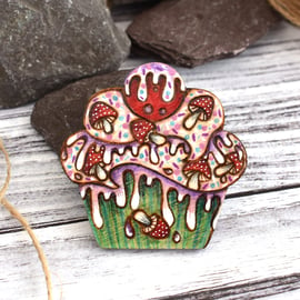 Toadstool cupcake brooch hand burned using pyrography.