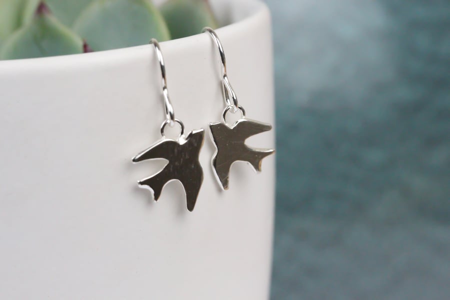 Polished silver swallow earrings