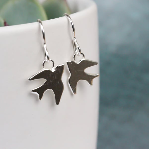 Polished silver swallow earrings