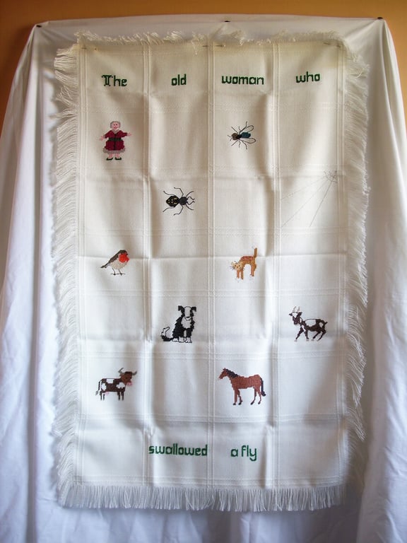 Shawl, wall hanging, 'The Old Woman who Swallowed a Fly', hand embroidered