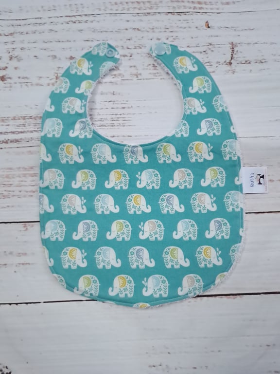 Unisex newborn baby bib with elephants on green