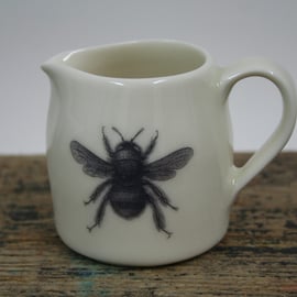 Porcelain jug with bee design