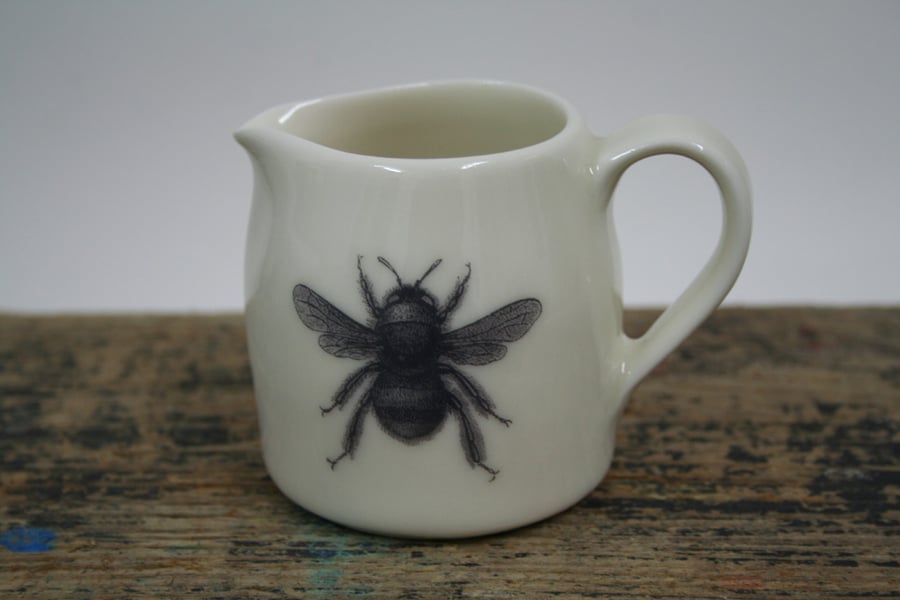 Porcelain jug with bee design