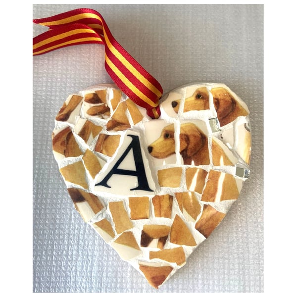 A heart shaped pendant with a Golden Labrador theme with the letter A