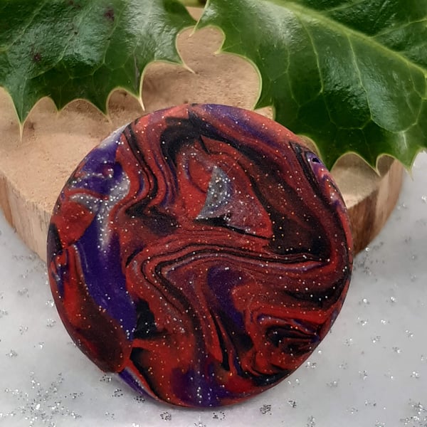 Festive red and purple brooch with a touch of sparkle