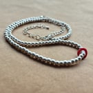 Matte Silver, dual occasion, red abstraction necklace.