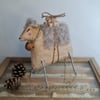 Handmade folk sheep with parcels