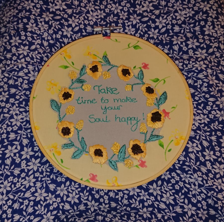 Embroidered sunflowers hoop picture, with caption. 