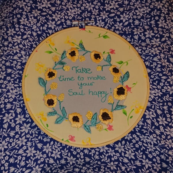 Embroidered sunflowers hoop picture, with caption. 