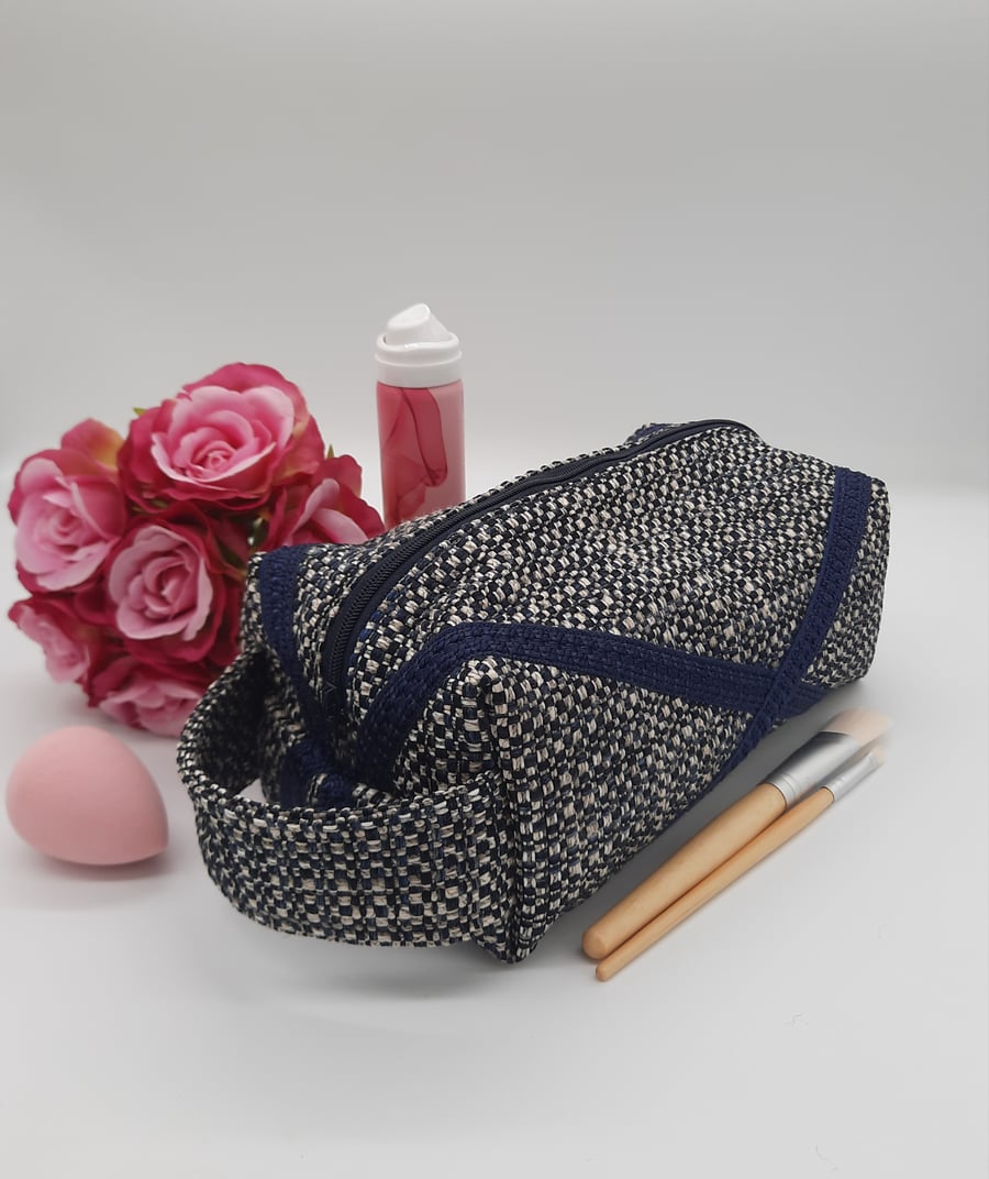 Toiletries makeup boxed bag with zip and handle in navy. 