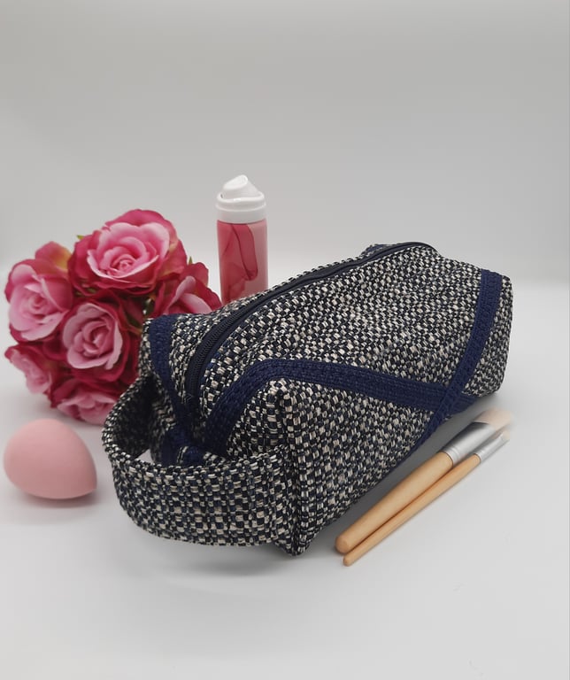 Toiletries, makeup bag in navy blue with zip and handle. Perfect for travel.  