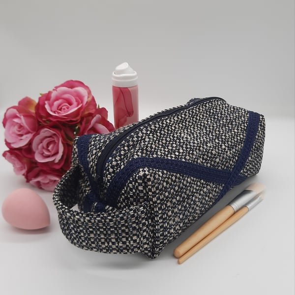 Toiletries makeup boxed bag with zip and handle in navy. 