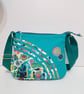 Small turquoise handbag with abstract flowers  - Image 9