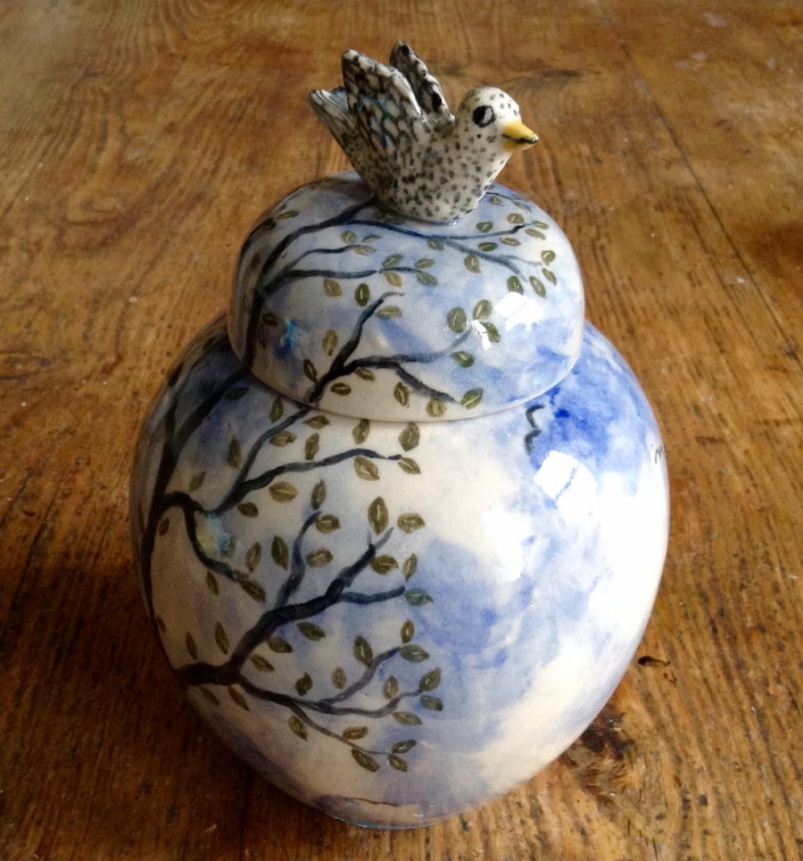 Storage jar with bird lid