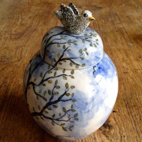 Storage jar with bird lid