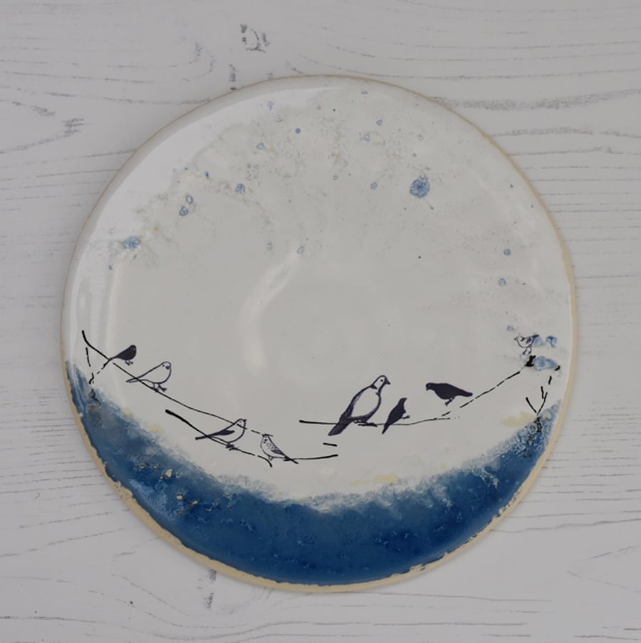 Birds on a wire white and azure blue round rimless plate - handmade pottery