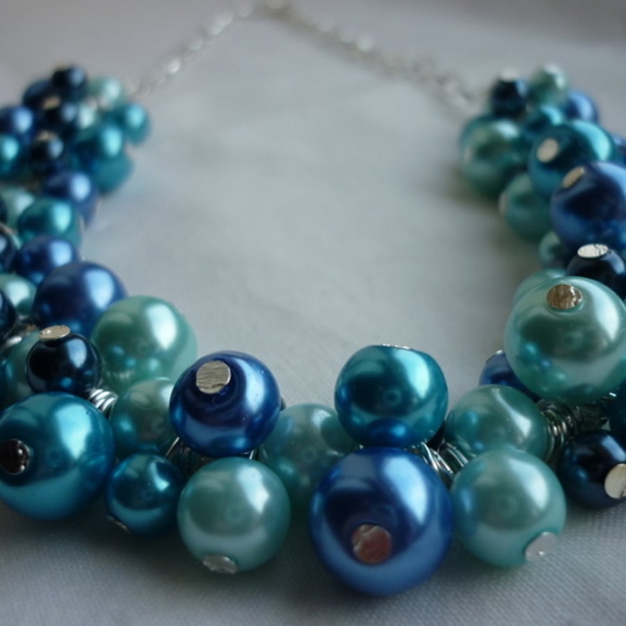 AQUA, TURQUOISE, SILVER AND SHADES OF BLUE CLUSTER NECKALCE.  246