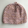 Popcorn patterned baby hat in a variegated yarn