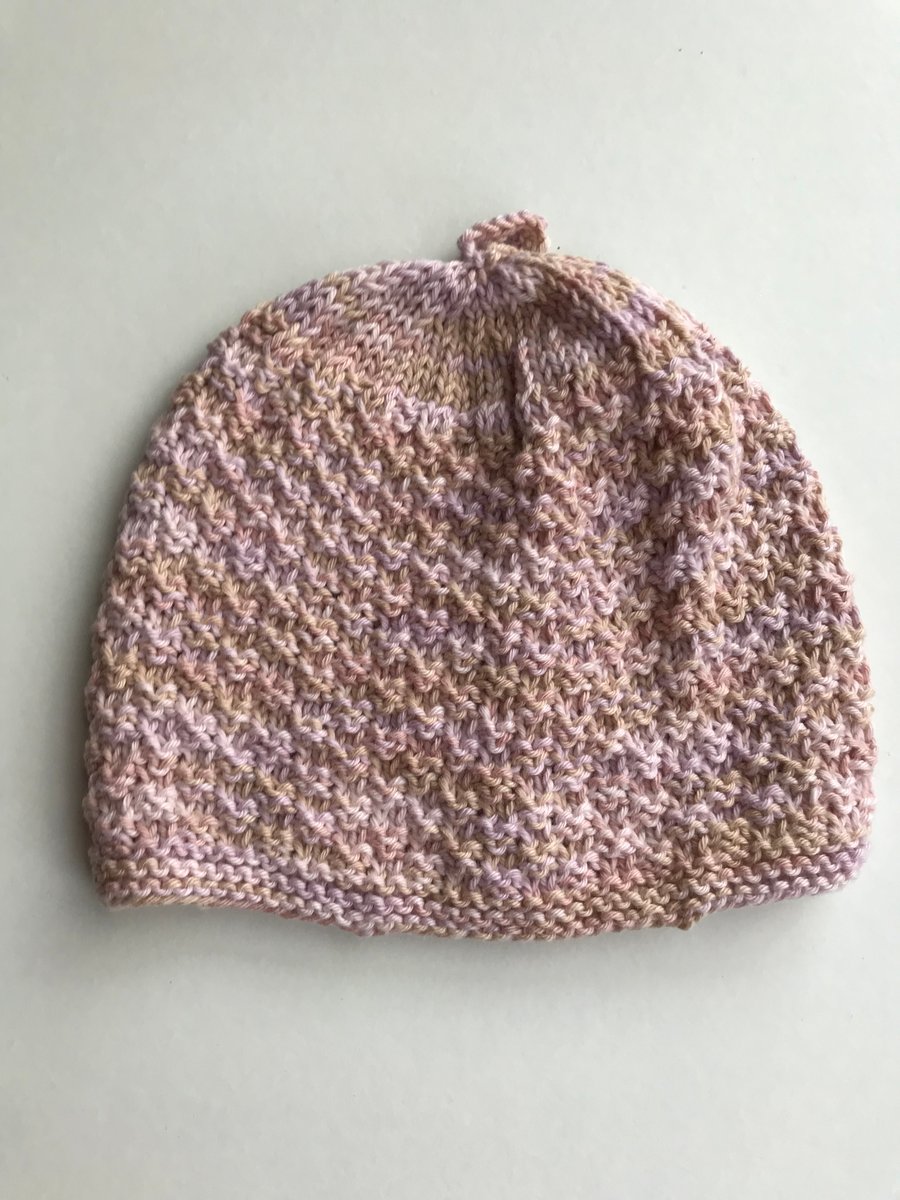 Popcorn patterned baby hat in a variegated yarn