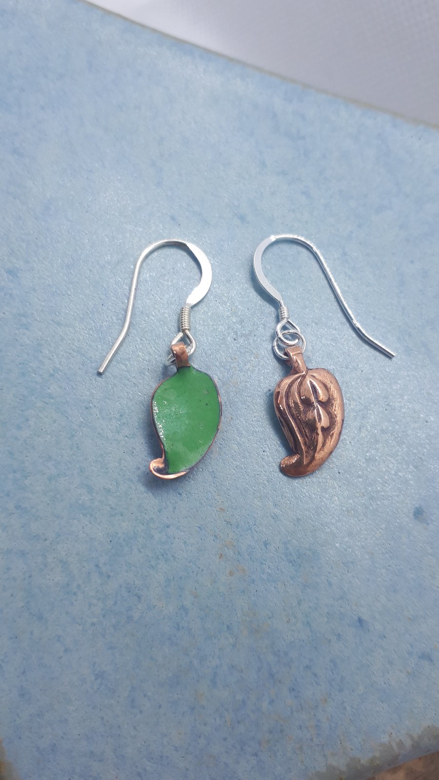 Copper leaves drop earrings with green enamel