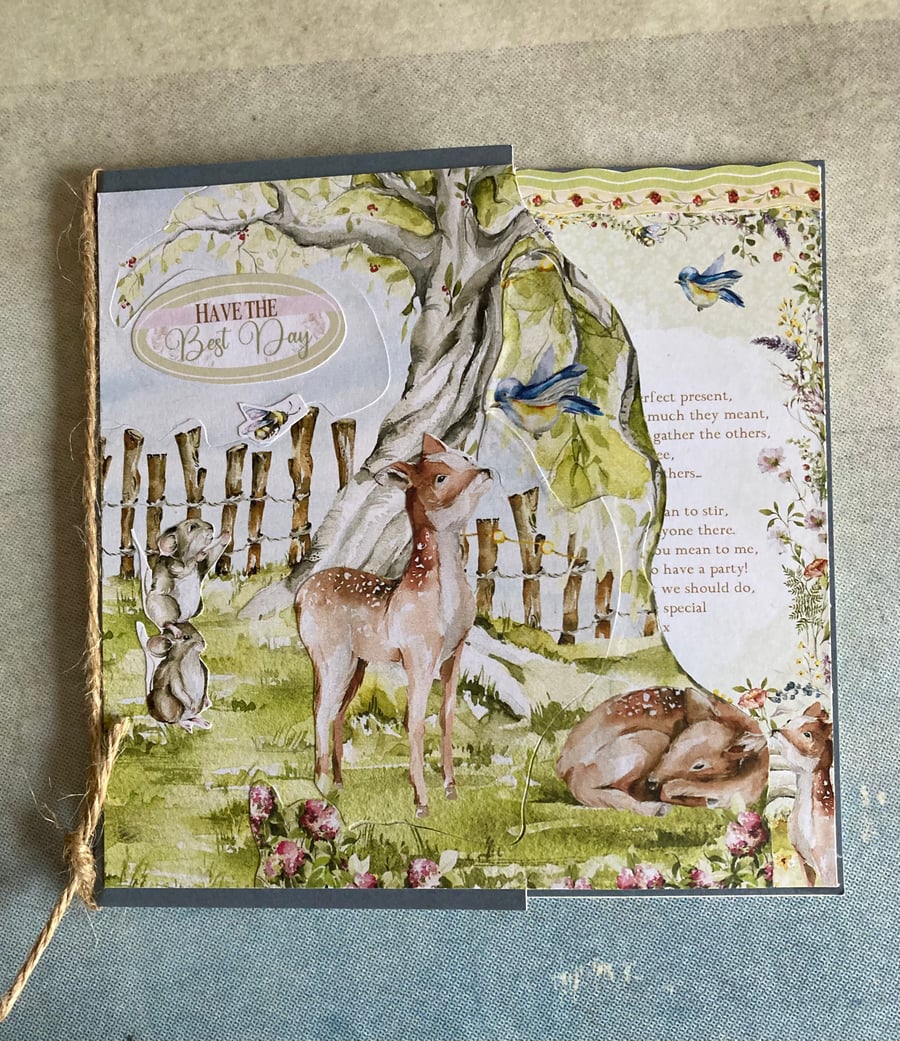 Card. A storybook card of deer in the woods.