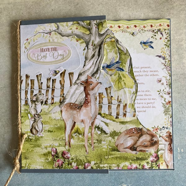 Card. A storybook card of deer in the woods.