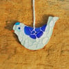 Blue and aquamarine bird mosaic from beach glass