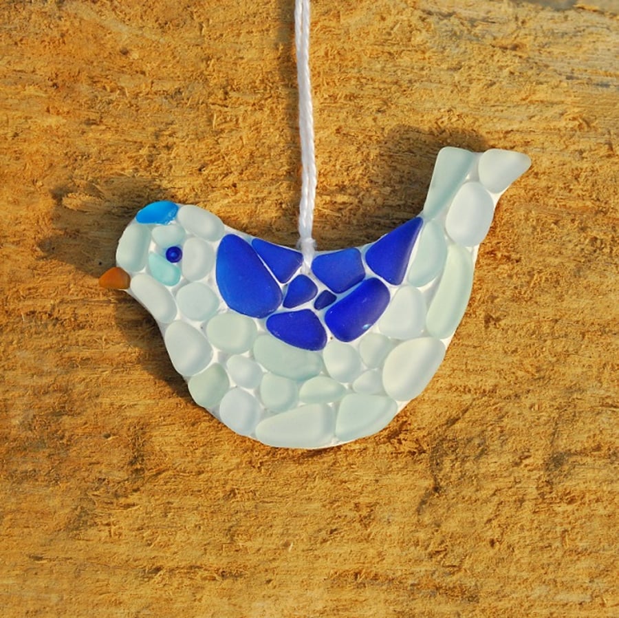 Blue and aquamarine bird mosaic from beach glass