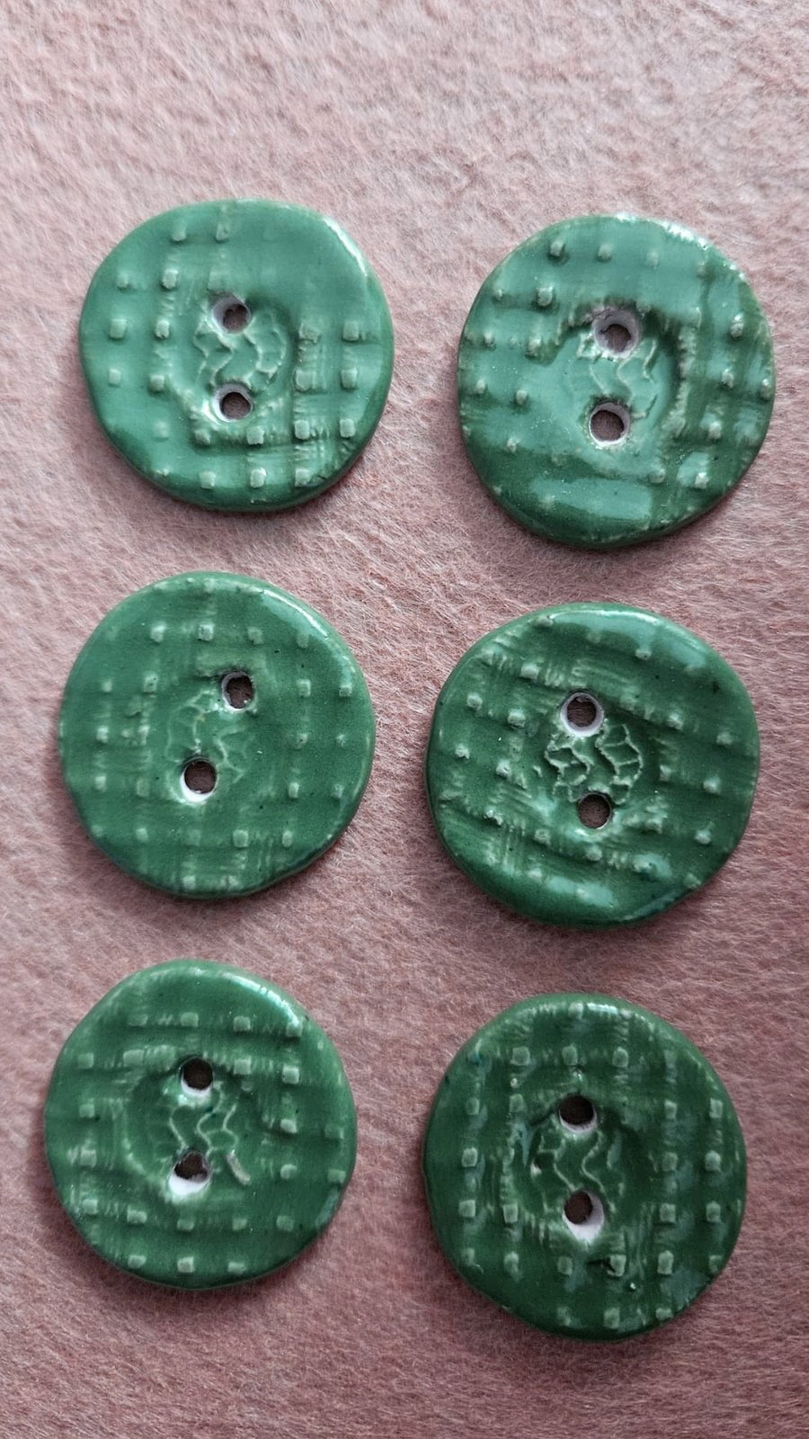 A Set Of Six Green Handmade Buttons