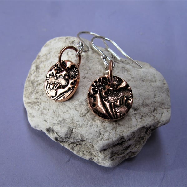 Sterling silver and copper earrings with floral pattern