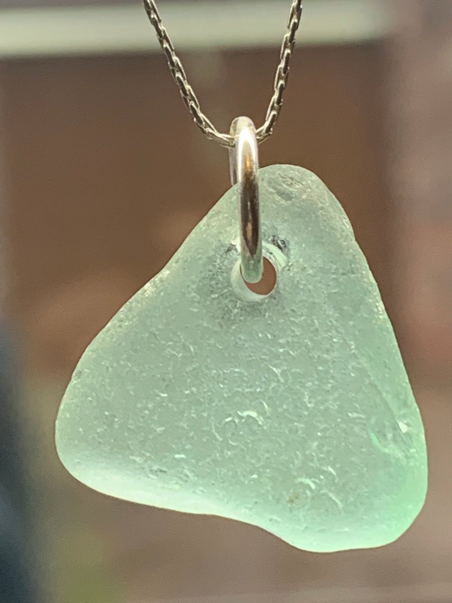 Sterling silver mounted blue-green seaglass pendant.