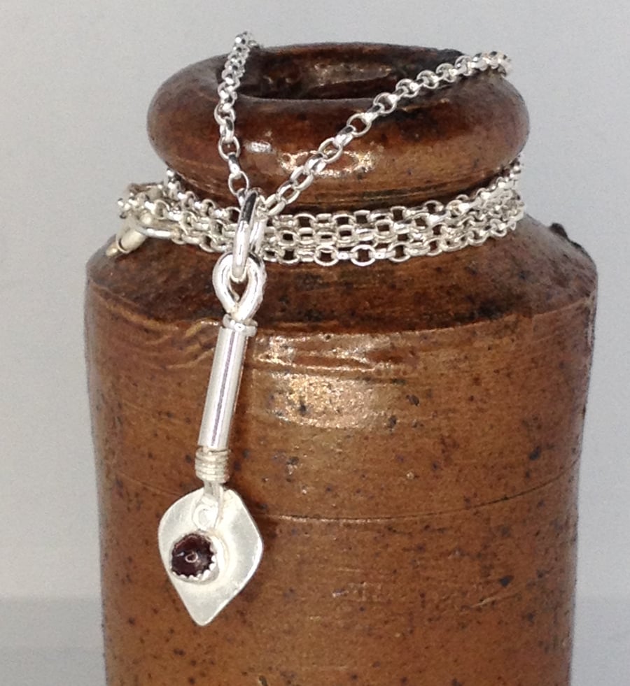 Tiny silver trowel pendant with Thames garnet