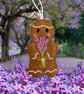 Gingerbread man holding some lavender Embroidered Hanging Keepsake 
