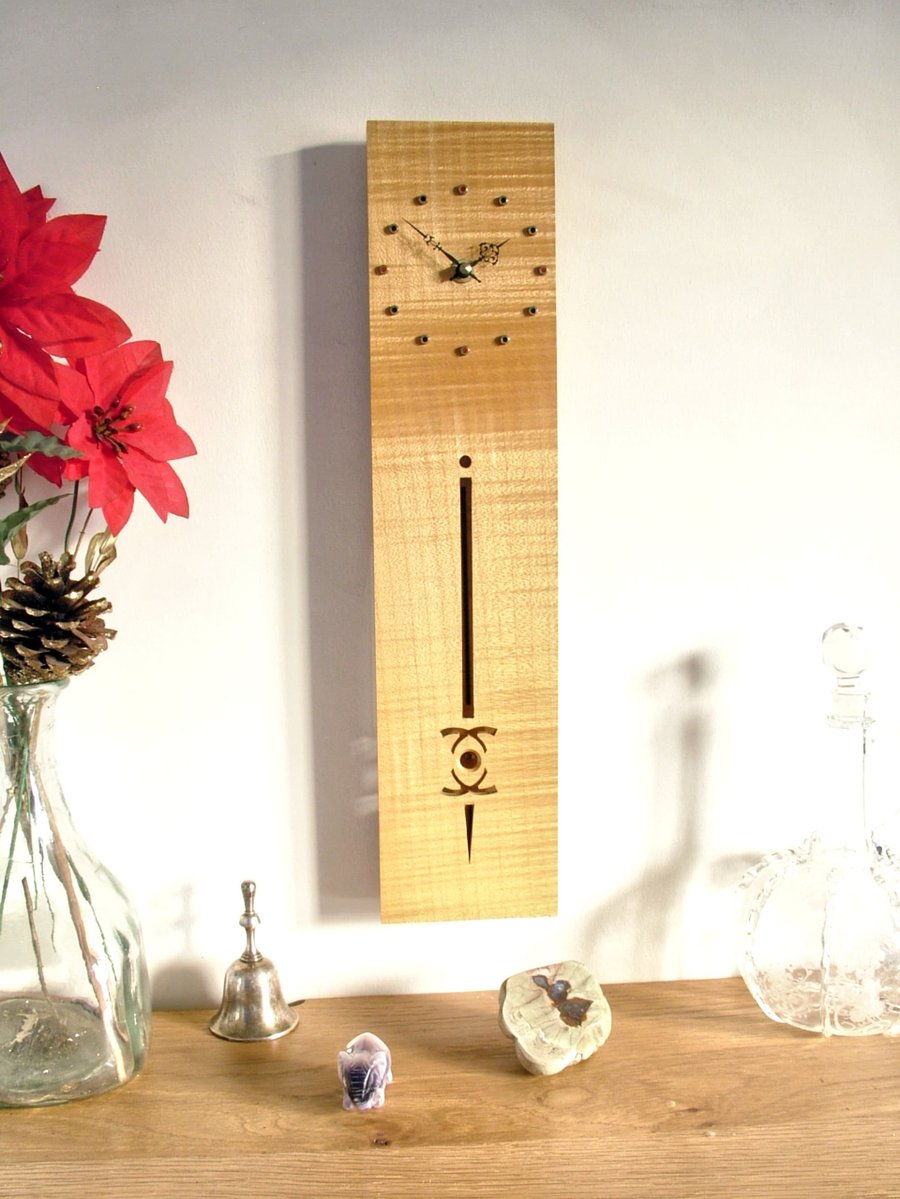 Wooden Pendulum Clock - ripple sycamore with brass hour marks and filigree hands