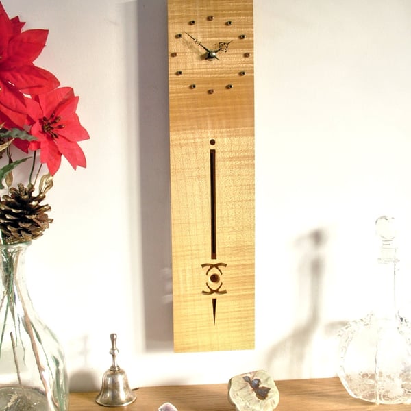 Wooden Pendulum Clock - ripple sycamore with brass hour marks and filigree hands