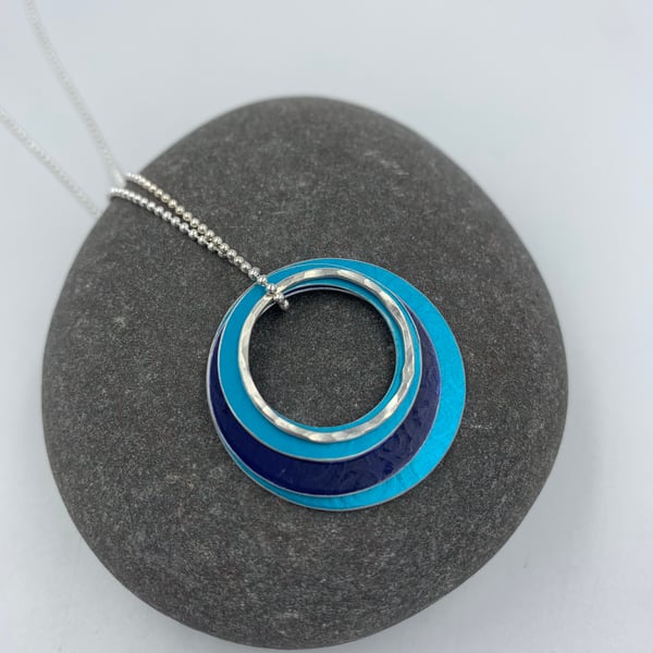 'Ripples' circle pendant in turquoise and navy with recycled silver rings