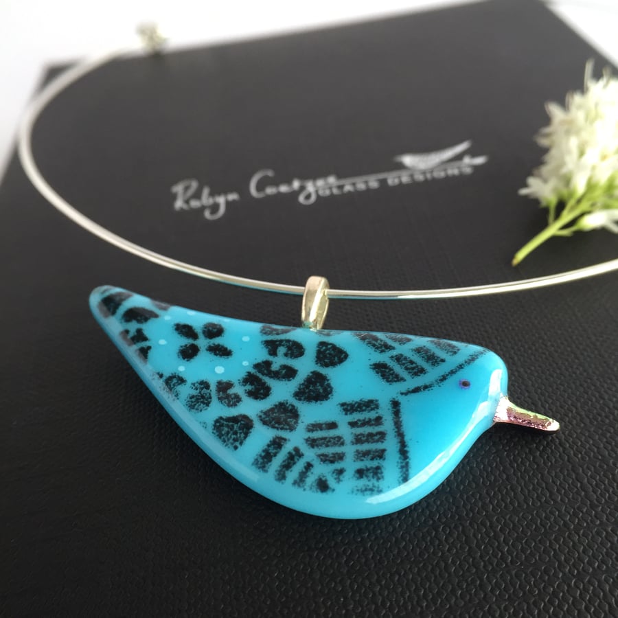 Turquoise and black bird glass pendant with silver beak.