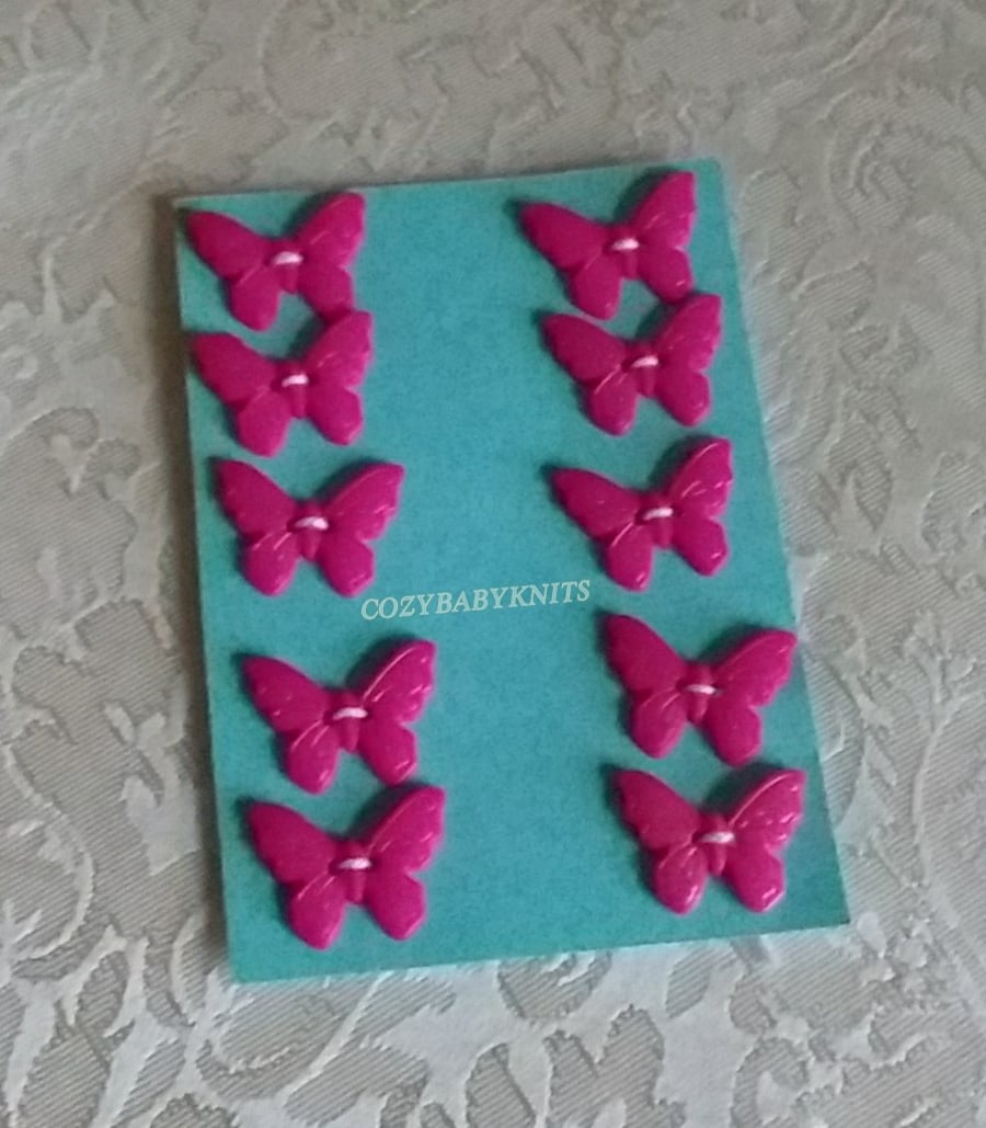 CERISE PLASTIC BUTTERFLY BUTTONS WITH TWO HOLES FOR ATTACHING 