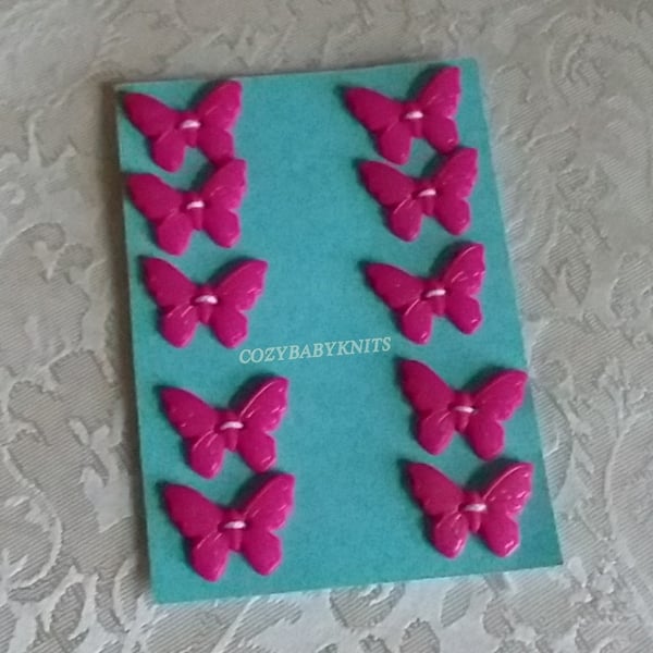 CERISE PLASTIC BUTTERFLY BUTTONS WITH TWO HOLES FOR ATTACHING 