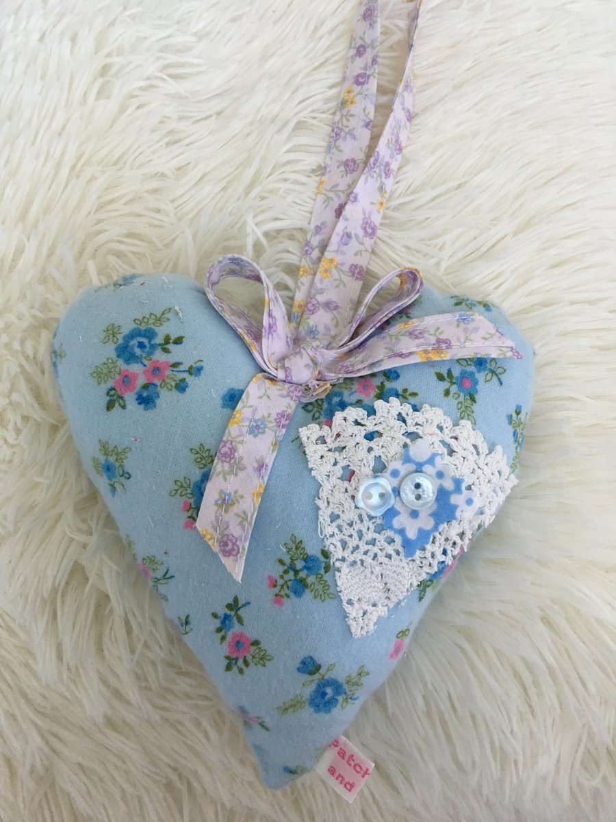 Large blue floral  fabric hanging heart with  ribbon and  lace 