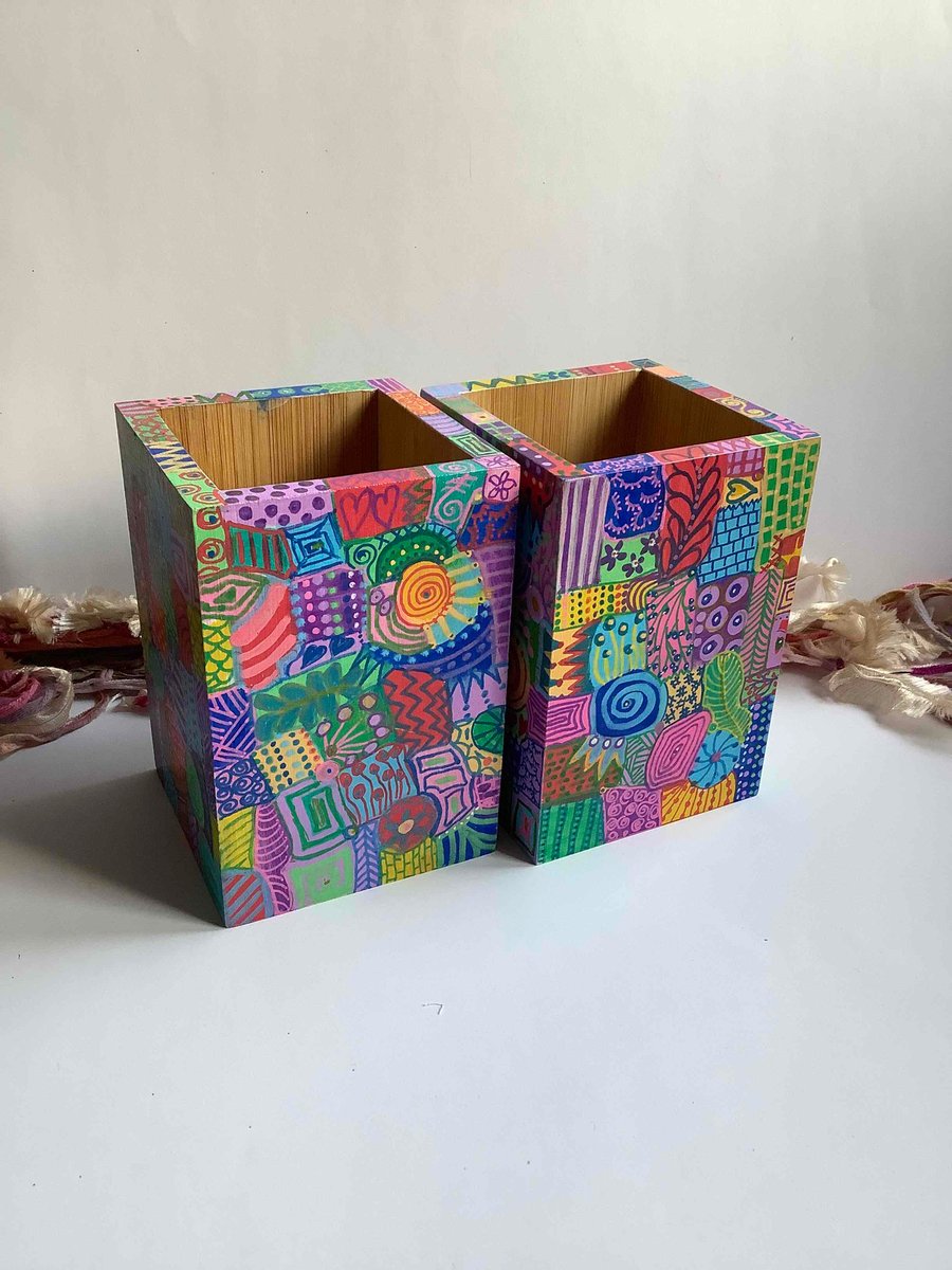 2 quirky hand painted bamboo holders 