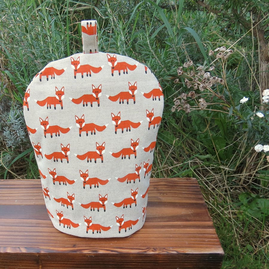 A cafetiere cosy with a fox design.  Size small, to fit a 2 cup cafetiere.