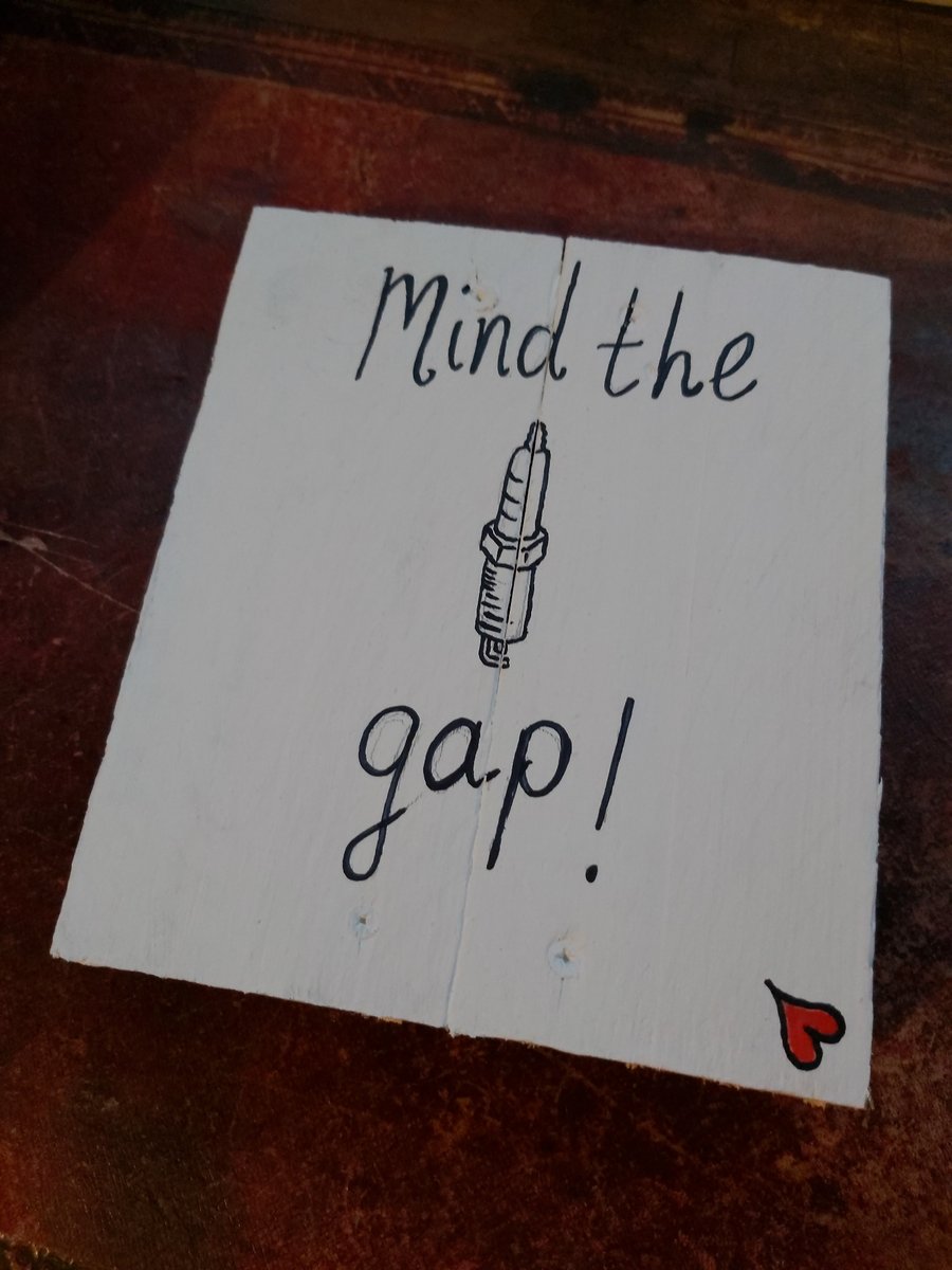 "Mind the gap" funny automotive themed wall hanging