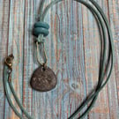 Pebble pendant with brass verdigris finish 