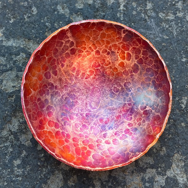 Flame painted copper bowl with hammered detail.
