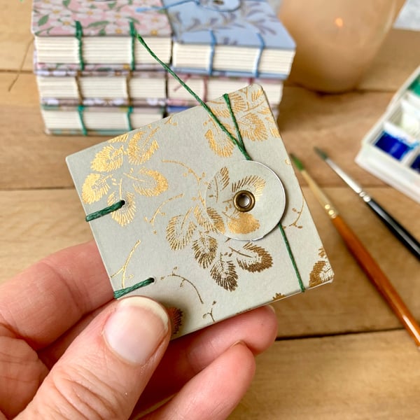 Coptic Bound Tiny Floral Watercolour Sketchbook. Green and gold.