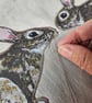 Handmade taupe-grey linen cushion with sewn printed rabbit & fluffy pompom tails - Image 5