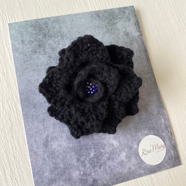 Crocheted black rose brooch