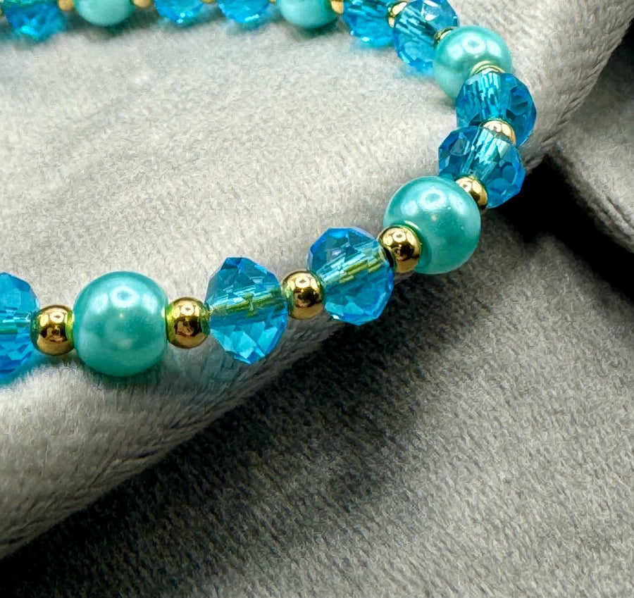 Blue glass pearl and bead bracelet.