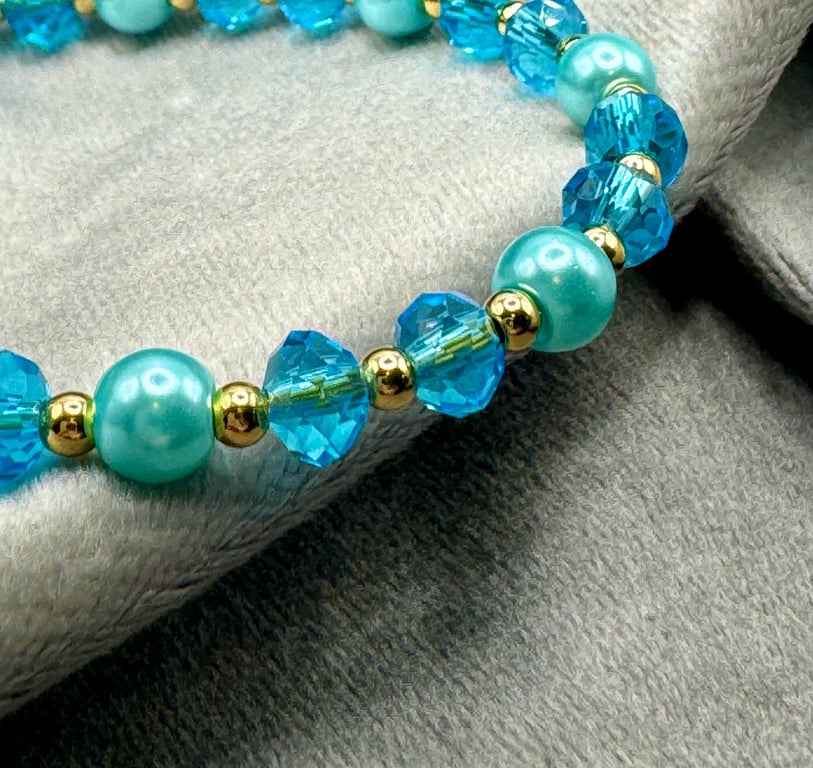 Blue glass pearl and bead bracelet.